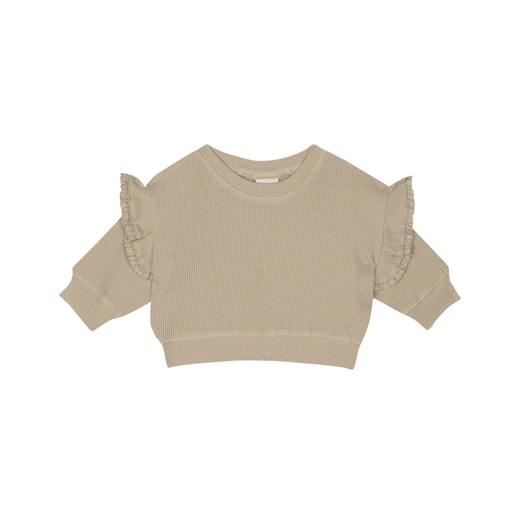 A beige ribbed knit long-sleeve crop top with ruffled shoulder details, shown flat on a white background.