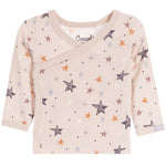 A baby long-sleeve wrap top in a light beige/cream color, decorated with an all-over pattern of stars and dots in various muted colors including orange, brown, gray, and white. 