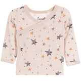 A baby long-sleeve wrap top in a light beige/cream color, decorated with an all-over pattern of stars and dots in various muted colors including orange, brown, gray, and white. 