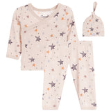 A three-piece baby clothing set including a long-sleeve wrap top, pants, and a knotted hat, all in a light beige color with an all-over star print in gray, white, and orange. 