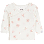 An off-white long-sleeve baby wrap top by Coccoli, featuring a delicate pink floral and leaf print scattered across the front.