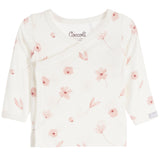 An off-white long-sleeve baby wrap top by Coccoli, featuring a delicate pink floral and leaf print scattered across the front.