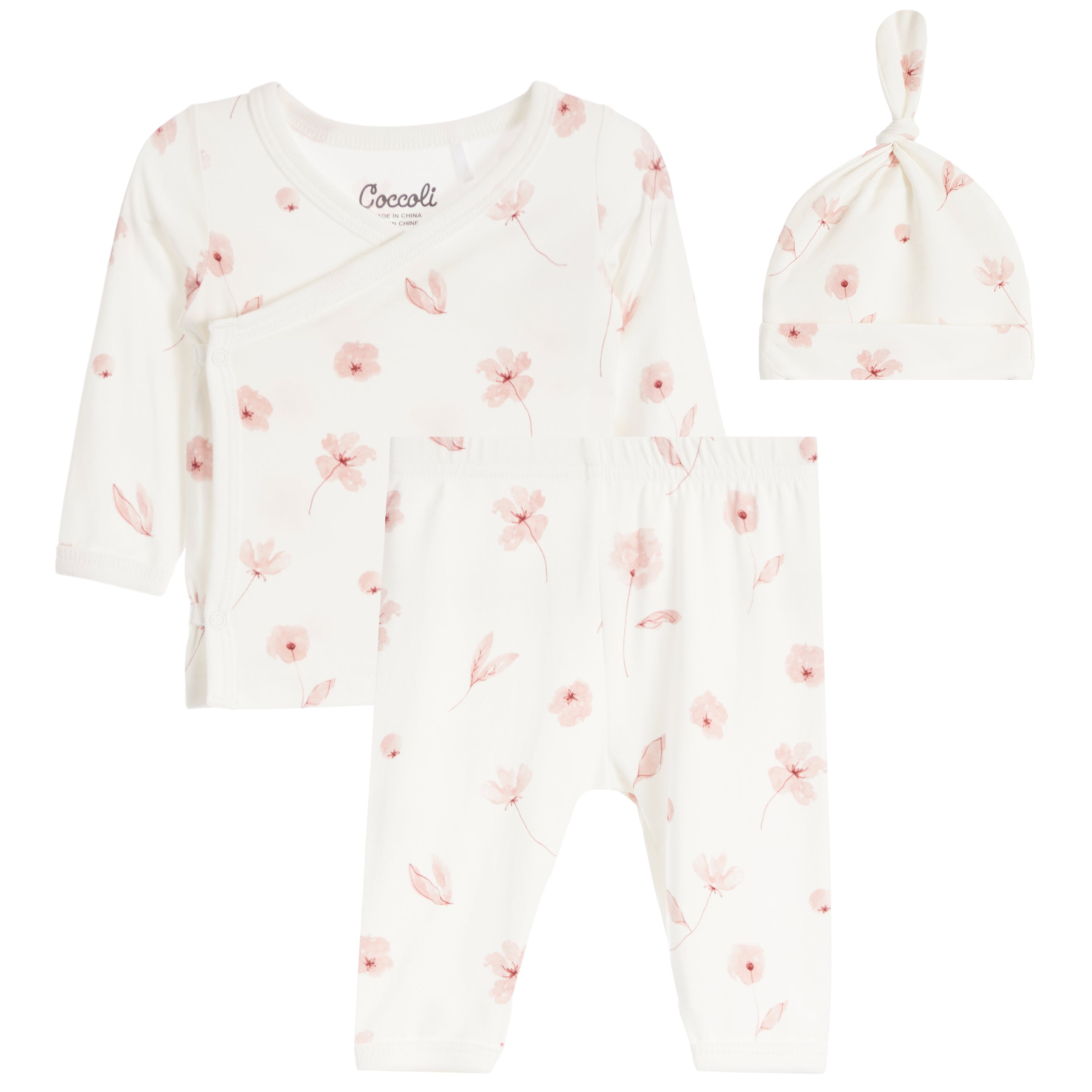 A three-piece baby clothing set featuring a long-sleeve wrap top, matching pants, and a knotted beanie, all in an off-white fabric with a delicate pink floral print.