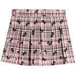 A pink plaid pleated skirt with a repeating black bow pattern, shown flat against a white background.