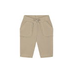 A pair of beige ribbed knit shorts for toddlers, featuring a drawstring waistband, side pockets with decorative ruffle trim, and a relaxed fit, shown against a plain white background.