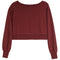 A long-sleeve cropped sweatshirt in a deep burgundy color, featuring a wide boat neckline, ribbed hem, and ribbed cuffs, shown against a plain white background.