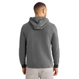 A man viewed from the back wearing a dark heather gray pullover hoodie with dark cuffs against a plain white background.