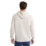 A man viewed from the back wearing a light cream heathered hoodie against a plain white background.