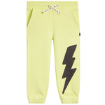 Light yellow-green jogger pants with a large black lightning bolt graphic on the right leg, featuring a white drawstring with black bolts.