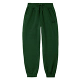 Dark green jogger sweatpants with an elastic drawstring waist and elastic cuffs, shown flat on a white background.