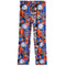 A pair of kids' basketball-themed pants featuring a vibrant all-over collage print of orange and blue basketball players, blue basketballs, white hoops, and text. The pants are shown flat against a solid white background.