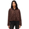 A woman modeling a cropped brown suede button-up shirt jacket with two front patch pockets, paired with dark jeans, against a plain white background.