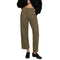 A person wearing olive green cropped pants with a black cropped top and black loafers, shown from the chest down on a plain white studio background.