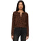 A woman modeling a brown long-sleeve button-front top with a black leopard print pattern, paired with dark jeans, against a plain white background.