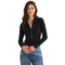 A woman modeling a black ribbed long-sleeve polo shirt with a buttoned placket, paired with blue jeans, against a plain white background.